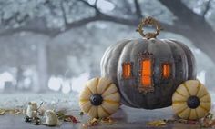 a pumpkin shaped lantern sitting on top of a table