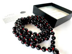 Handmade in Rochester Hills - Michigan, using only high quality natural 8MM black Onyx gemstones that are sourced ethically (and we put extra effort to keep it that way ). WATERPROOF, ADJUSTABLE and  KNOTTED between each bead.  We ship within 1-2 business days. * Gemstone: Black Onyx * Bead size: 8 mm * Circumference Length: 39 inches + 2 inches adjustable * Number of gemstones: 108 beads + 1 guru bead * Knotted * Wear this Mala as a bracelet or as a necklace. Gemstone description card included. Handmade Black Onyx Beads, Black Polished Beads Necklace For Healing, Black Onyx 8mm Beads, Onyx Beaded Necklaces With 8mm Beads As Gift, Black 108 Beads Jewelry Gift, Handmade Black Spiritual Beads, Handmade Spiritual Black Beads, Black Spiritual Healing Beads, Black Beaded Bracelet With 108 Beads For Meditation