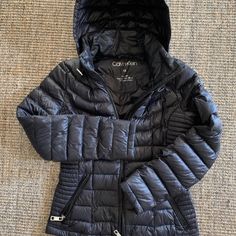 - Lightweight Calvin Klein Puffer Jacket - Form Fitting - Xs But Fits More Like A Small (I Normally Wear Size Small And This Jacket Fits Me Perfectly) - Worn Only Occasionally For The Past Few Months - Shows No Signs Of Wear! - Will Come Dry Cleaned - The Last Photo Is The Jacket From A Website So You Can See It On A Model (Only Different Color, Same Jacket) :) Feel Free To Submit Offers! Calvin Klein Puffer Jacket, Jacket Fits, Calvin Klein Black, Womens Calvin Klein, Puffer Jacket, See It, Calvin Klein, Puffer, The Past