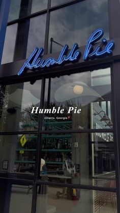 the front window of a restaurant that sells humble pie