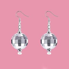 Quality-Made Retro Disco Ball Earrings / Solid Piece Disco Ball Earrings / Cute 70s 80s Disco Earrings Accessory You will look so cool rocking these retro disco ball earrings. The super bright light bounces off of your ears to create an awesome effect. Perfect for parties, concerts, festivals and more! We want your disco ball earrings to make you feel like a princess and this pair will do just that! Vintage style, quality jewelry to wear more than once at parties, clubs, or for everyday enjoymen Retro Metal Earrings For Party, Retro Metal Party Earrings, Metal Round Plug Earrings For Party, Round Metal Plug Earrings For Party, Metal Plug Earrings For Party, Nickel-free Drop Earrings For Party, Retro Jewelry For Pierced Ears For Parties, Retro Dangle Jewelry For Party, Retro Silver Earrings For Pierced Ears