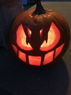 a carved pumpkin sitting on the ground