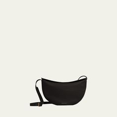 Mansur Gavriel "Moon" sling crossbody bag in leather, cotton, and linen  Adjustable crossbody strap Zip top closure  Approx. 5"H x 9.5"W x 2.8"D Made in Italy Modern Saddle Bag With Dust Bag For Everyday, Modern Crossbody Saddle Bag With Dust Bag, Modern Leather Crossbody Saddle Bag, Sling Crossbody Bag, Mansur Gavriel, Zip Top, Crossbody Strap, Leather Crossbody Bag, Leather Crossbody