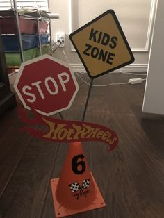 there are two signs that say kids zone and stop on the same sign as each other