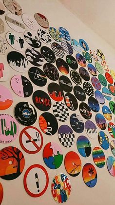 a wall covered in lots of different types of stickers