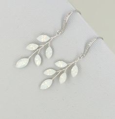 Similar design with more leaves and branches: https://www.etsy.com/listing/626875120/vine-earrings-silver-wedding-earrings?ref=shop_home_active_9&pro=1&frs=1 materials: Swarovski white opal crystal, cubic zicornia paved ear wires, tarnish resistant wires. Sizes: full length approx 4.5cm . very light weight. Color: Available in Gold, Silver and Rose Gold. Please choose a color when you place order. This piece will be shipped out in 3-6 working days *Back to my storefront: http://www.etsy. Dainty Opal Earrings For Wedding, Silver Opal Earrings For Wedding, Vine Earrings, Boho Bridal Jewelry, Boho Wedding Earrings, Silver Bridal Earrings, Wedding Chandelier, Rose Gold Crystal, Earrings Rose Gold