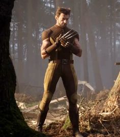 a man dressed as wolverine stands in the woods