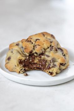 a chocolate chip cookie on a white plate