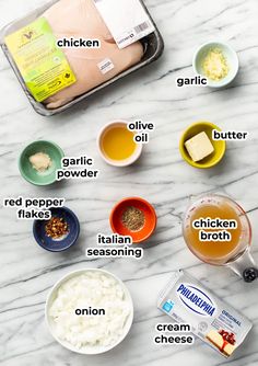 ingredients to make chicken broth laid out on a marble counter top with text overlay