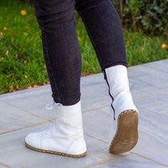 Step into a world of elegance and natural connection with the Barefoot Grounding Effect White Leather Boots For Women by Nefes Shoes. These boots blend the purity of white with the essence of nature, offering both style and a deeper connection to the earth. Designed for the modern woman who values comfort and style, our Whiteboot provides the freedom of barefoot walking. With grounding copper rivets enhancing each step, these boots not only support your feet but also harmonize your stride with t Leather Boots For Women, Barefoot Boots, White Leather Boots, Men’s Boots, Natural Form, Leather Boots Women, Buffalo Leather, White Boots, Boots Women