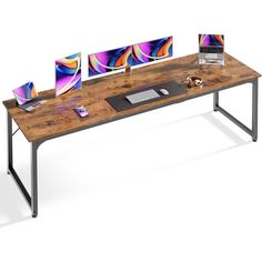 a computer desk with three monitors and a keyboard on it, in front of a white background