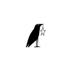 a black bird with a star in its beak