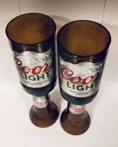 two empty beer bottles sitting next to each other