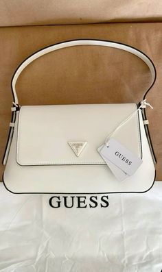 #guess #handbags #bag #mini #glowing #luxury #luxurious #luxurylife #elegant #elegance #womanoutfits #womanfashiontrend White Bags Aesthetic, New Bag Instagram Story, White Purses And Handbags, Guess White Bag, White Guess Bag, Hand Bags Aesthetic, White Purse Aesthetic, Aesthetic Bags Handbags, Trendy Bags 2024