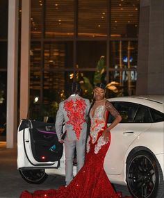 Silver And Red Prom Dress, Prom Suit Designs For Men, Red Prom Suits For Black Men, Unique Prom Colors, Prom Suit Ideas For Black Men, Men Prom Suits Ideas, Silver And Red Prom, Red Suit Prom, Prom Colors For Couples Black