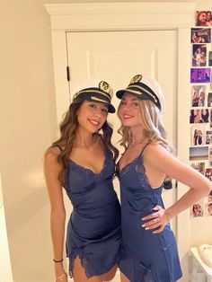 two beautiful young women dressed in sailor outfits