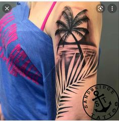 a woman's arm with a palm tree tattoo on it