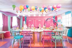 a dining room filled with lots of colorful balloons