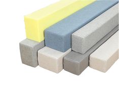 four different colored foam blocks stacked on top of each other