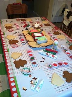 the table is covered with cookies and candy