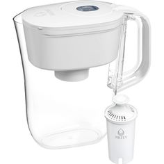 a water pitcher with a filter attached to the side and a cup next to it