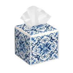 a tissue box with blue and white designs on it