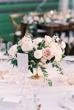 the table is set with flowers and wine glasses on it for an instagram wedding