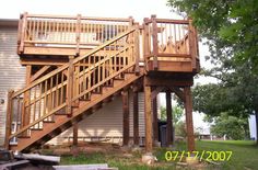 a wooden staircase leading up to a house