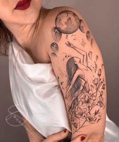 a woman with a tattoo on her arm and shoulder is holding onto a white dress