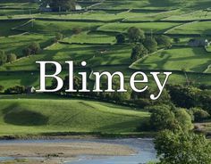 the word blmey is surrounded by green fields and trees, with a river running between them