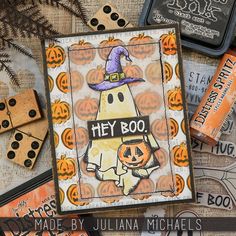 halloween themed cards with pumpkins and other items on top of each card, including two dice