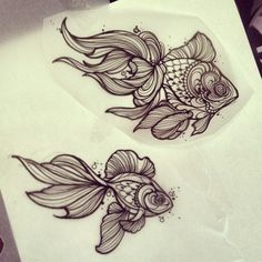 two goldfish tattoo designs on white paper