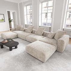 a living room with white carpet and large sectional couch in front of two windows on the wall