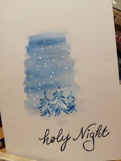 a card with the words holly night written in black ink on white paper and trees