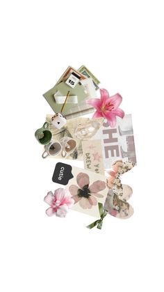 a pile of papers with flowers and pictures on top of it, all in different shapes and sizes