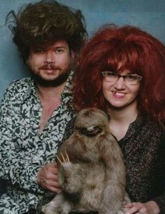 a man and woman with red hair posing for a photo