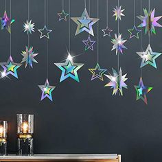 the stars are hanging from the ceiling and on the wall in front of the table