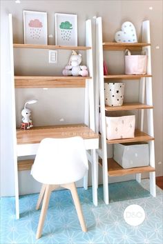 there is a desk and shelves with toys on it in the room that looks like a child's playroom