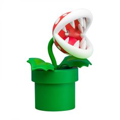 a green container with a red and white object in the shape of a monster's mouth