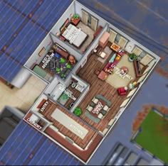 an aerial view of a house with the living room and dining area in one corner