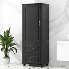 a black cabinet next to a white toilet in a room with marble walls and flooring