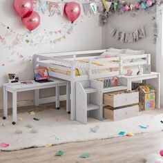 a child's bedroom with white furniture and balloons on the wall above it, along with confetti streamers