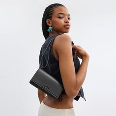 Don’t let its name fool you: the put-together Bandit is as sophisticated as they come. Detailed with our C pushpin closure this flap front crossbody is crafted of luxe refined leather with a high shine finish. The dual compartment design features a secure interior snap pocket a convenient exterior pocket and a shoulder strap that adjusts for crossbody wear. (But be warned it may steal your heart). | Coach Bandit Crossbody Bag - Women's Designer Crossbody - Matte Black/black Coach Logo, Large Wallet, Designer Crossbody, Crossbody Bag Women, New Handbags, Belt Bag, Design Features, Bags Women, Designing Women