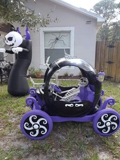 an inflatable car with skeleton decorations on the front and back wheels is parked outside