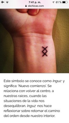 a small wrist tattoo with an x on it