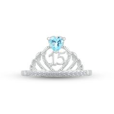 Make her feel majestic on her special day with this sparkly crown ring crafted in sterling silver. A heart-shaped Swiss blue topaz – the birthstone of December – shines atop the design. The number 15 gleams inside the heart-shaped center, while a line of white lab-created sapphires shimmer on the band to finish the look. Blue Sterling Silver Heart Ring For Anniversary, Heart-shaped Cubic Zirconia Birthstone Promise Ring, Sterling Silver Crown-shaped Promise Ring, Heart-shaped Blue Birthstone Ring Gift, Blue Heart-shaped Sterling Silver Rings, Number 15, White Lab, Crown Ring, Ring Crafts