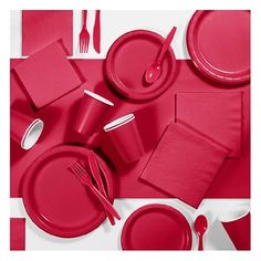 a red table setting with place settings and napkins on the side, along with utensils