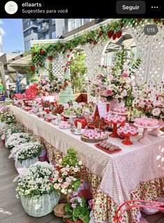 a long table covered in lots of flowers