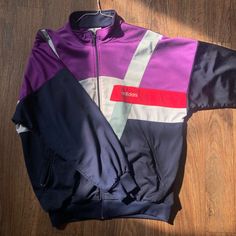 90s Vintage Adidas Jacket Pit to Pit: 24" No marked size.  I fit a woman's medium.  This jacket fits me a bit oversized. I would guess this is a woman's Large.  Purple, Pink, White and Blue Zip Up.  The pockets zip too. Jacket Streetwear, 90s Adidas, Adidas Zip Up, Violet Rose, 90s Jacket, Adidas Vintage, Jacket Fits, Adidas Jackets, Pink Jacket