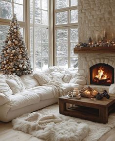 a living room filled with furniture and a fire place in front of a christmas tree